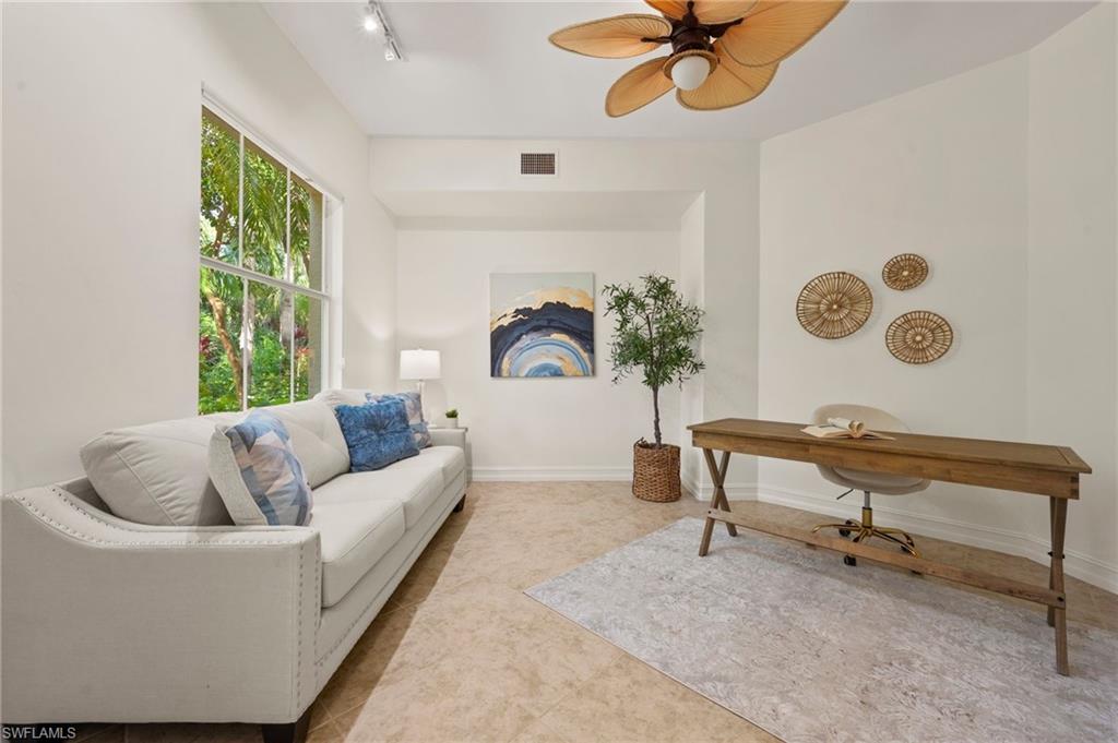 2886 Castillo Court, Unit 101 Naples, FL 34109 - Photo 25 of 45 a living room with furniture and a window