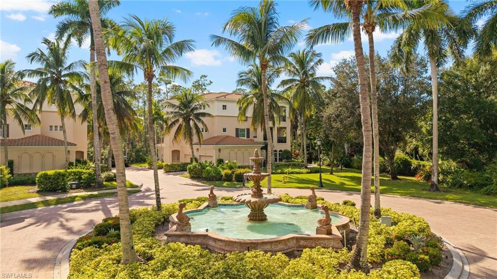 2886 Castillo Court, Unit 101 Naples, FL 34109 - Photo 31 of 45 a swimming pool with outdoor seating and yard