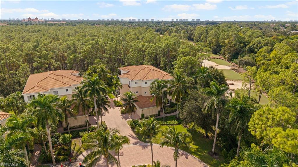 2886 Castillo Court, Unit 101 Naples, FL 34109 - Photo 32 of 45 a view of a lake in middle of the town