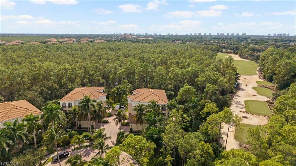 2886 Castillo Court, Unit 101 Naples, FL 34109 - Photo 38 of 45 a view of a lake with a city