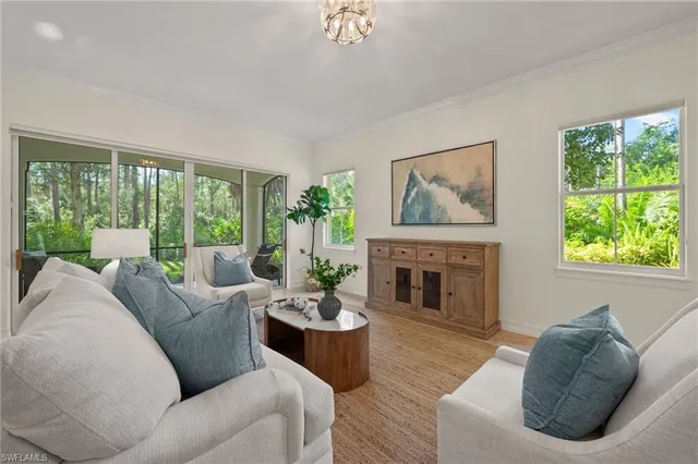 a large kitchen with stainless steel appliances kitchen island granite countertop a sink and refrigerator