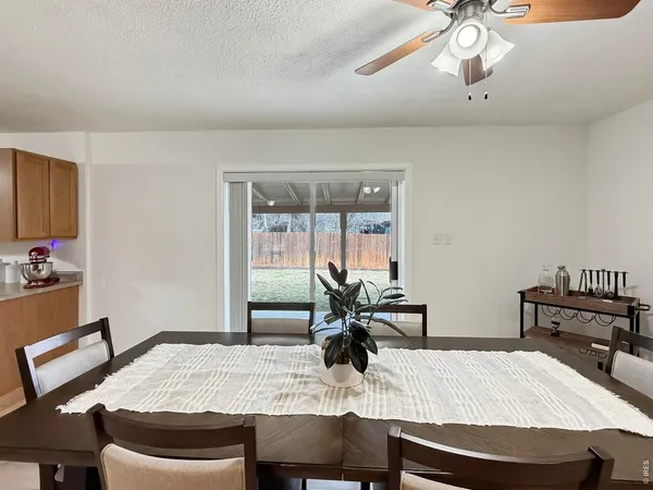 a dining room with a table and chairs