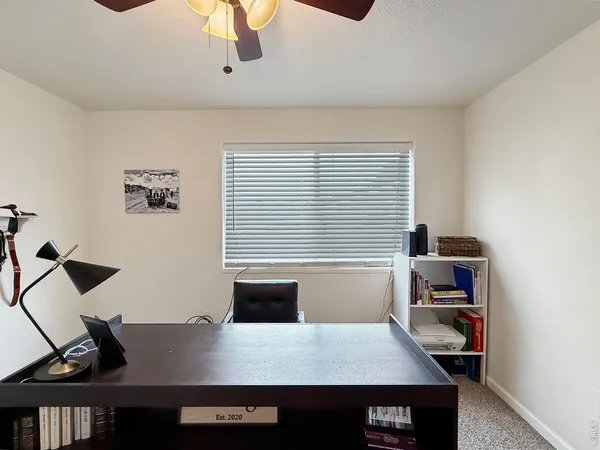 a view of a workspace with furniture