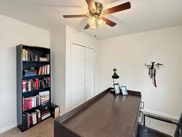 a view of a workspace with furniture