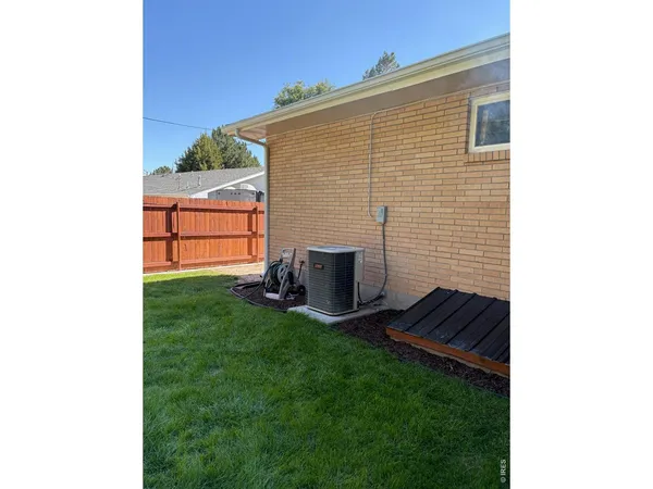 a backyard of a house with seating space