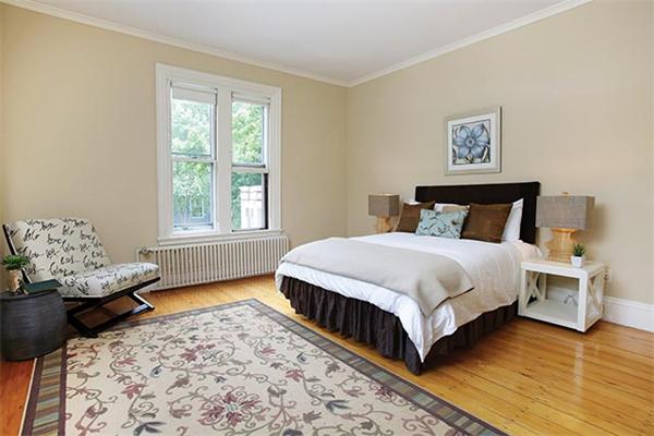 273 Walnut Street Brookline, MA 02445 - Photo 8 of 10 a bedroom with a bed and window