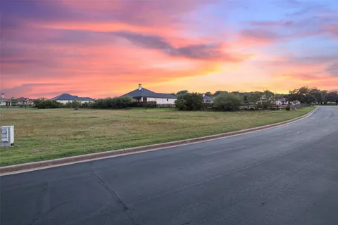 a view of a field with an ocean