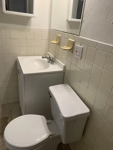 a bathroom with a toilet and a sink