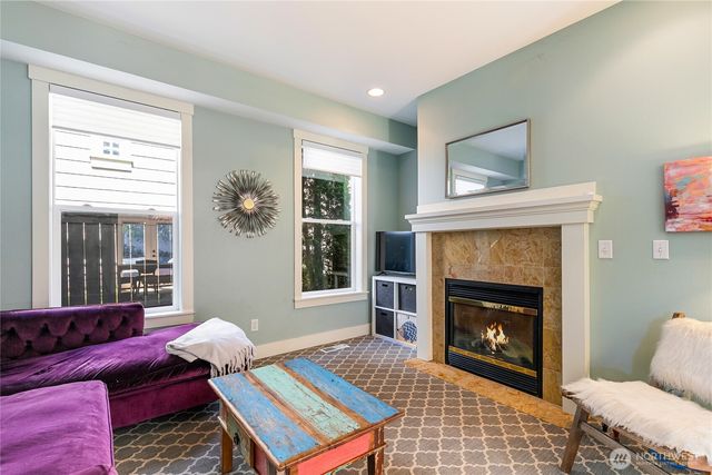 a living room with furniture and a rug