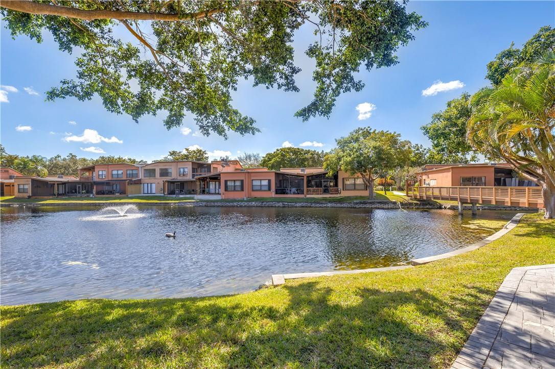a view of a swimming pool with an outdoor seating