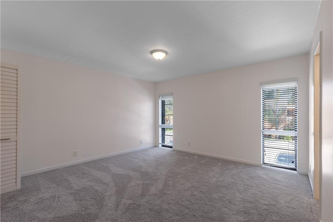 9717 North New River Canal Road, Unit 409 Plantation, FL 33324 - Photo 11 of 20 an empty room with closet and windows