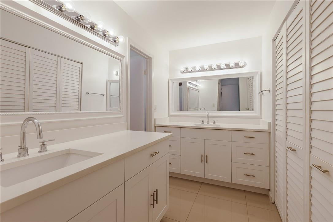 9717 North New River Canal Road, Unit 409 Plantation, FL 33324 - Photo 13 of 20 a bathroom with a sink and a mirror