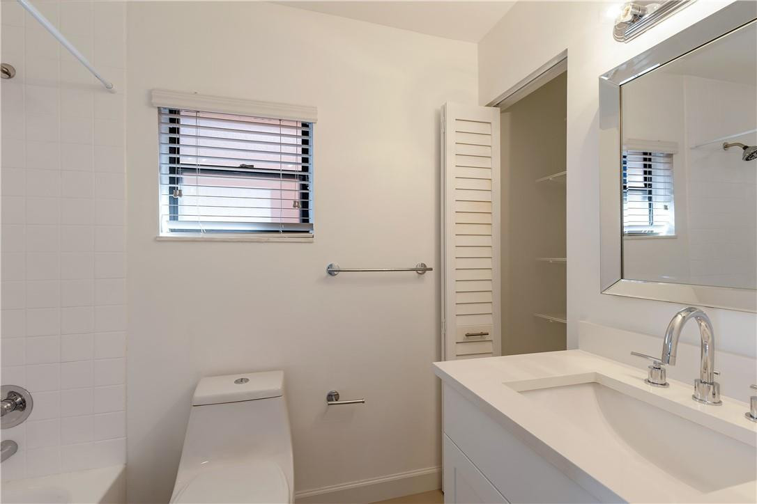 9717 North New River Canal Road, Unit 409 Plantation, FL 33324 - Photo 15 of 20 a bathroom with a sink a toilet and shower