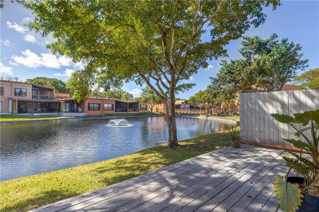9717 North New River Canal Road, Unit 409 Plantation, FL 33324 - Photo 17 of 20 a view of a lake with houses