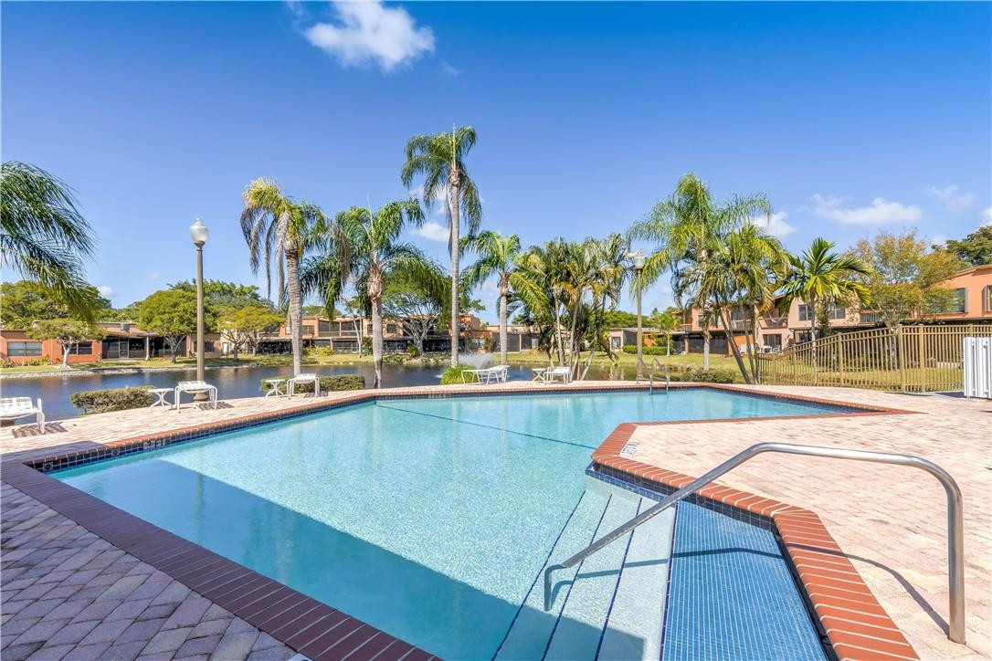 9717 North New River Canal Road, Unit 409 Plantation, FL 33324 - Photo 20 of 20 a view of swimming pool with outdoor seating and city view