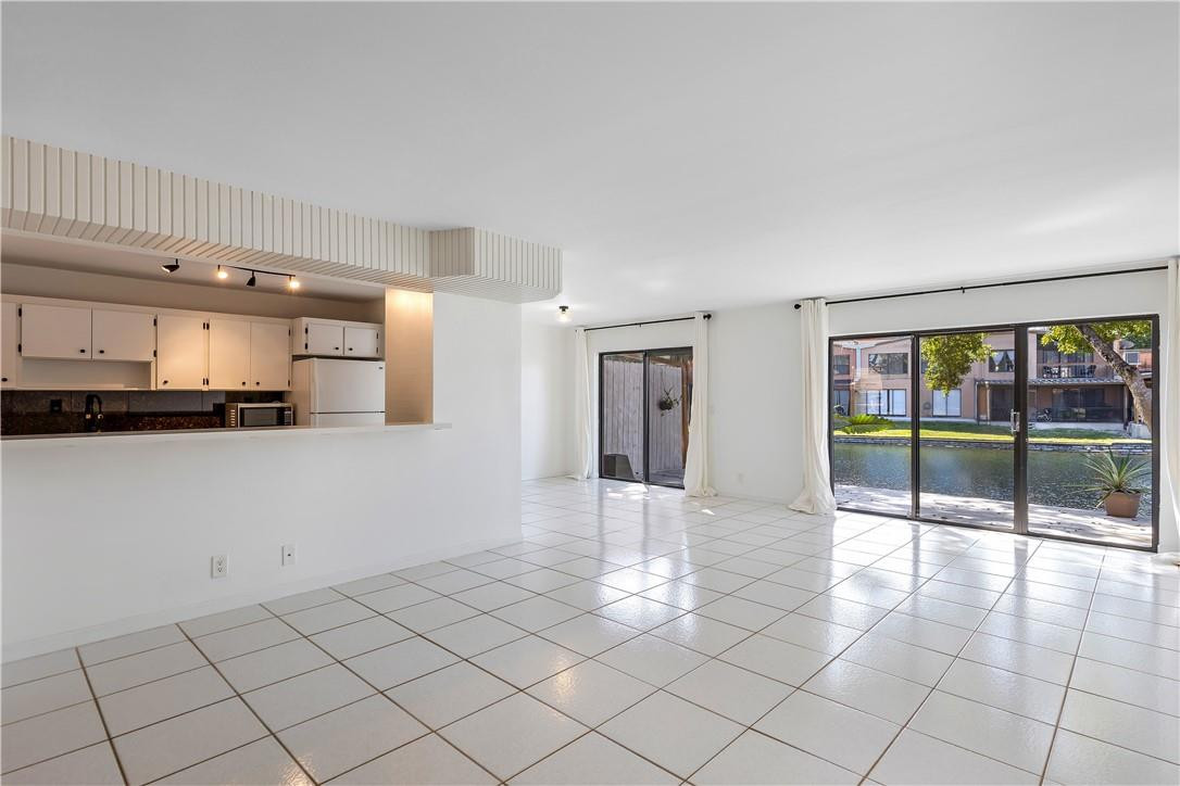 9717 North New River Canal Road, Unit 409 Plantation, FL 33324 - Photo 2 of 20 a view of an empty room and window