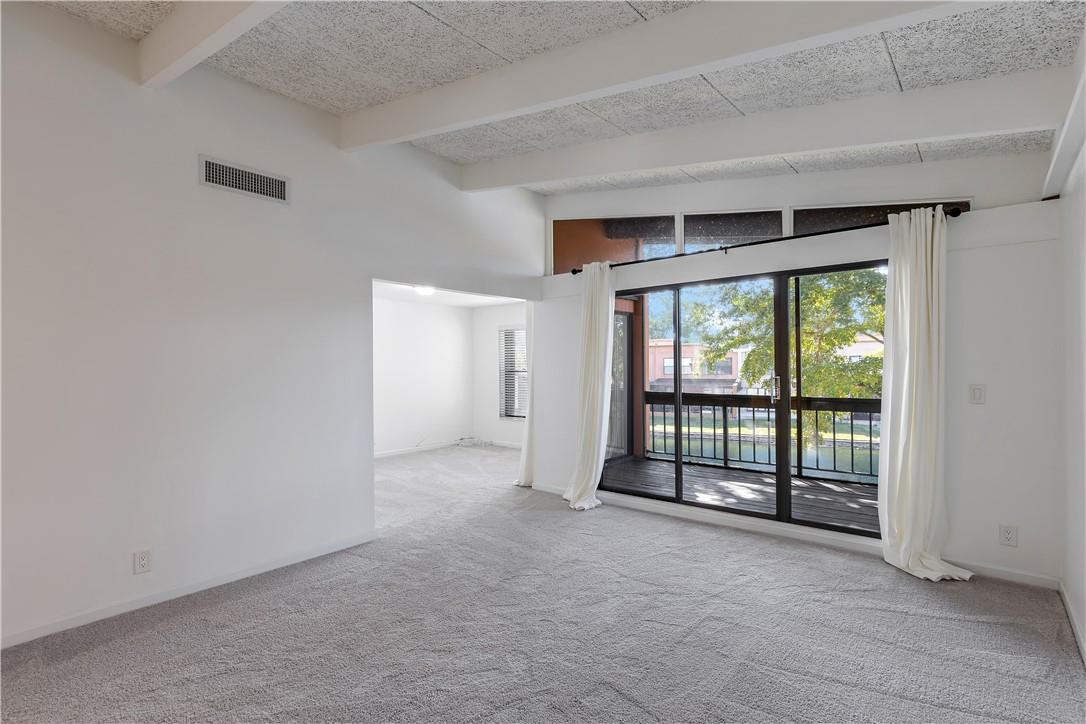 9717 North New River Canal Road, Unit 409 Plantation, FL 33324 - Photo 5 of 20 a view of an empty room with a sliding door