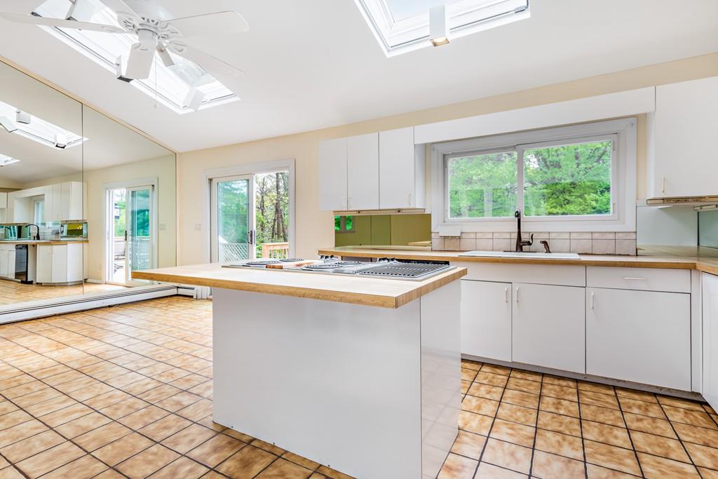 40 James Road Hanover, MA 02339 - Photo 21 of 41 a kitchen with granite countertop a sink and a stove top oven