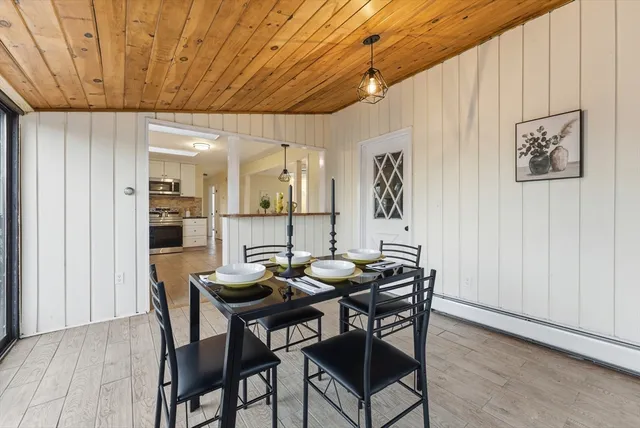 a dining room with furniture and window