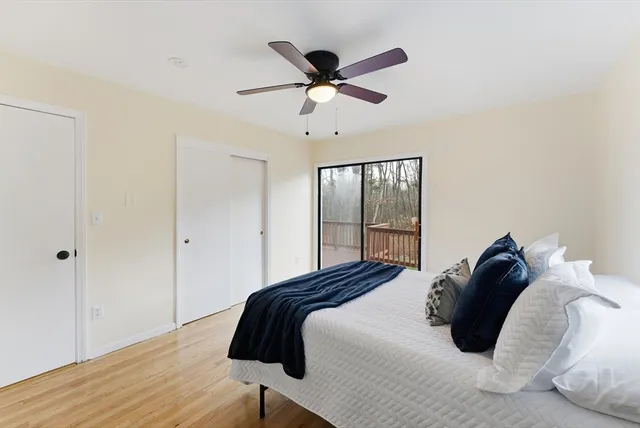 a bedroom with a bed and window