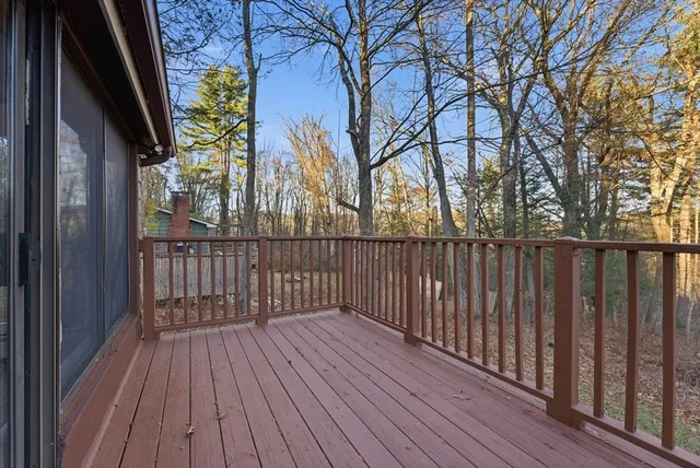 a view of wooden balcony with wooden floor