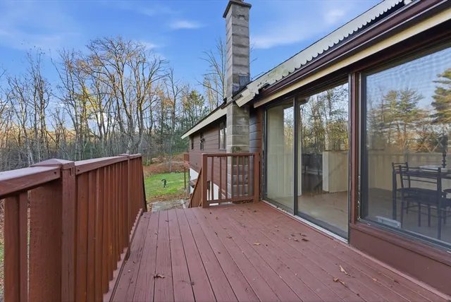 a view of backyard with hardwood and deck