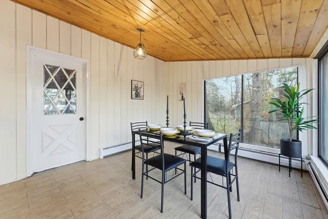 a view of a dining room with furniture window and outside view
