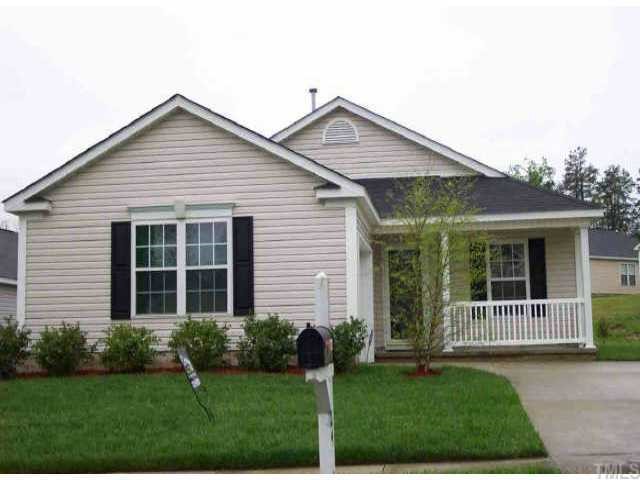 5017 Silverdene Street Raleigh, NC 27616 - Photo 1 of 1 a view of a house with a yard and plants