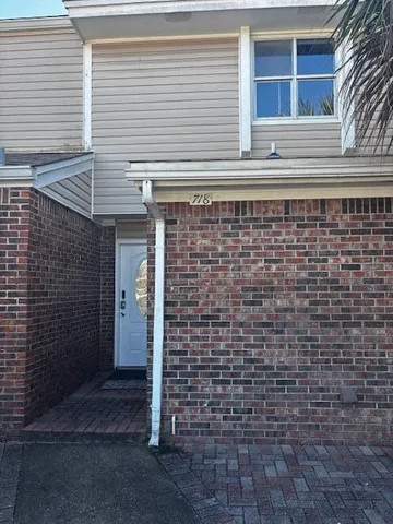 a view of a brick house with a door