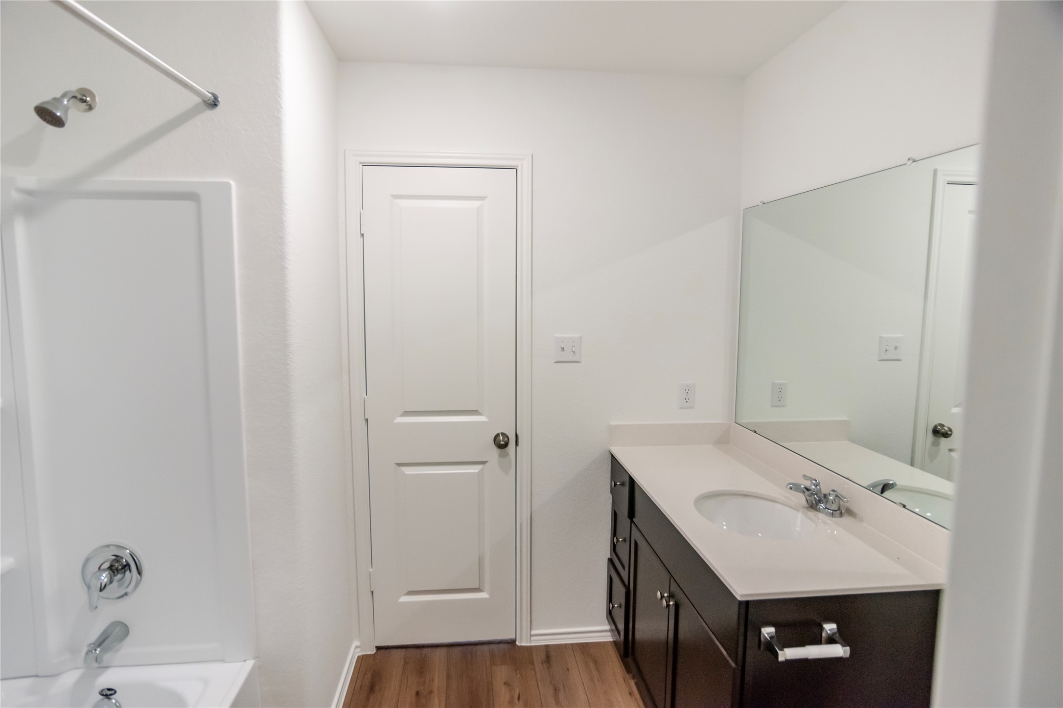 112 Dollars Drive Jarrell, TX 76537 - Photo 15 of 27 a bathroom with a sink a mirror and a shower