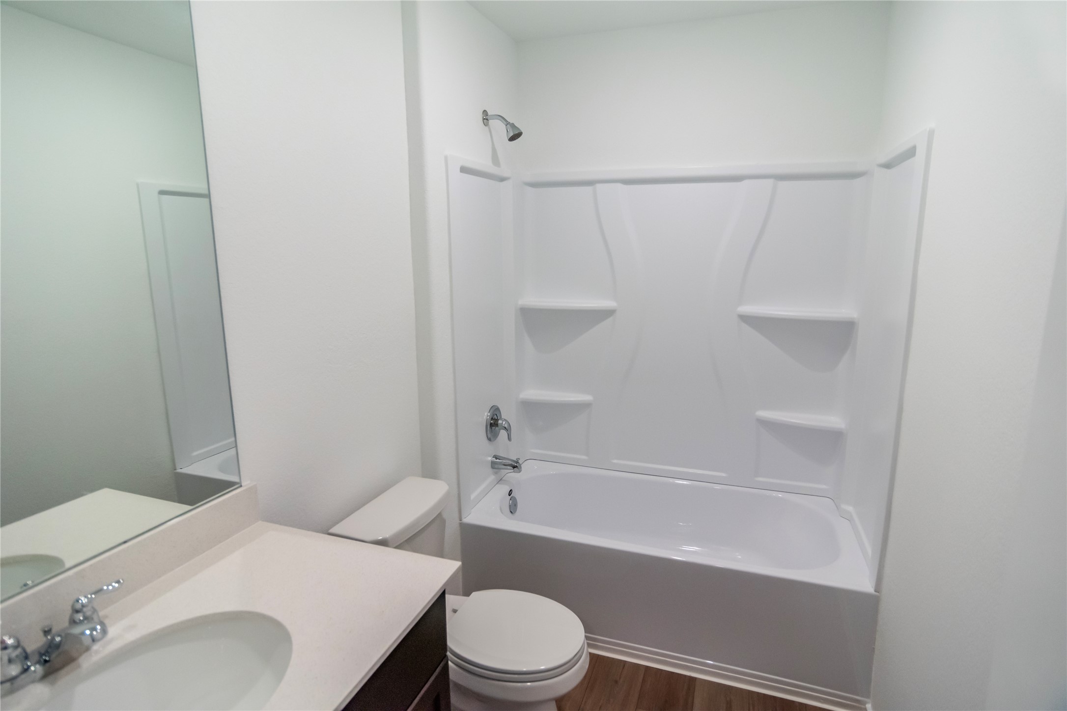 112 Dollars Drive Jarrell, TX 76537 - Photo 18 of 27 a bathroom with a sink toilet and bathtub