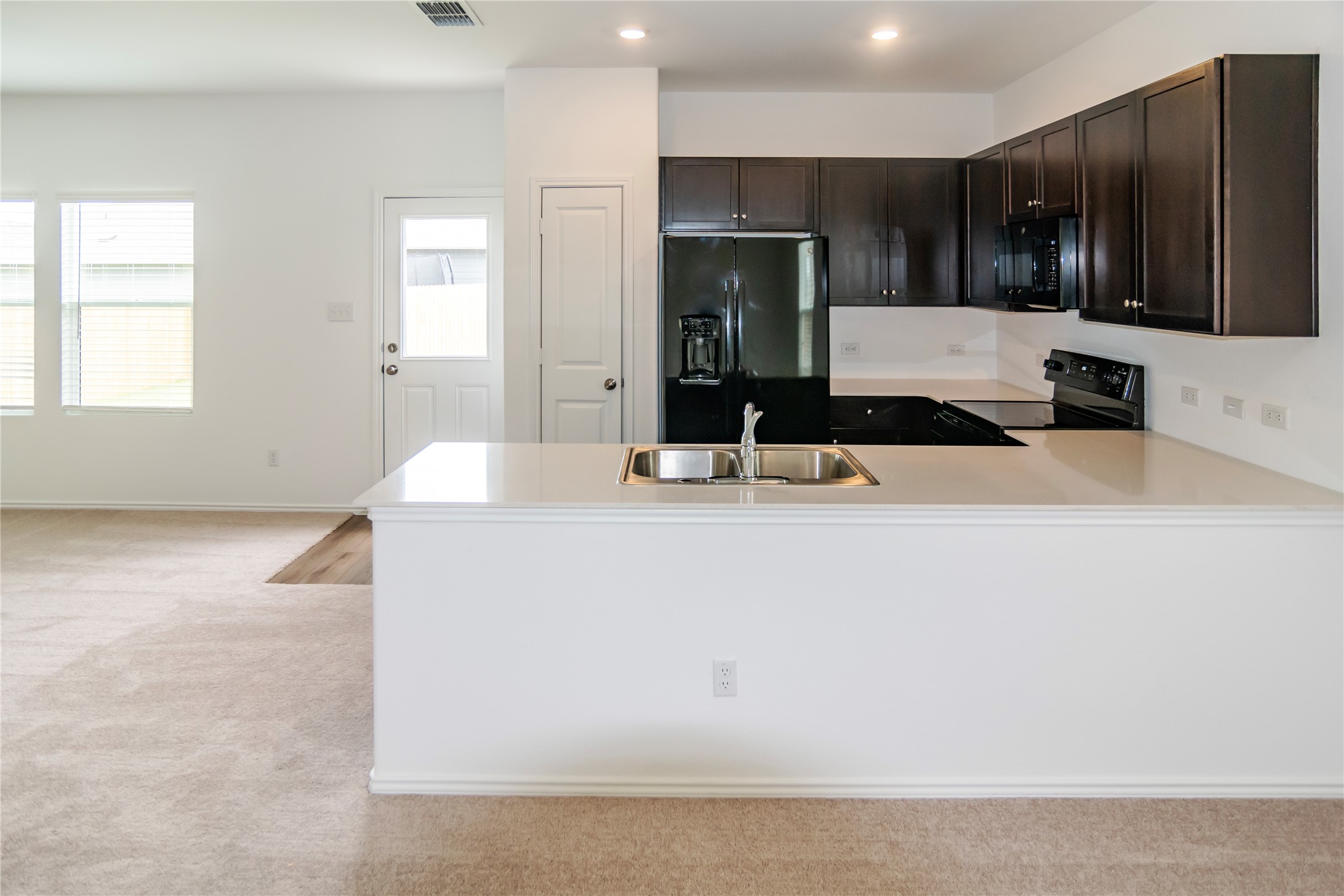 112 Dollars Drive Jarrell, TX 76537 - Photo 6 of 27 a kitchen with kitchen island a sink stainless steel appliances and cabinets