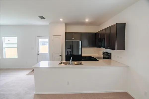 a view of a kitchen and a window