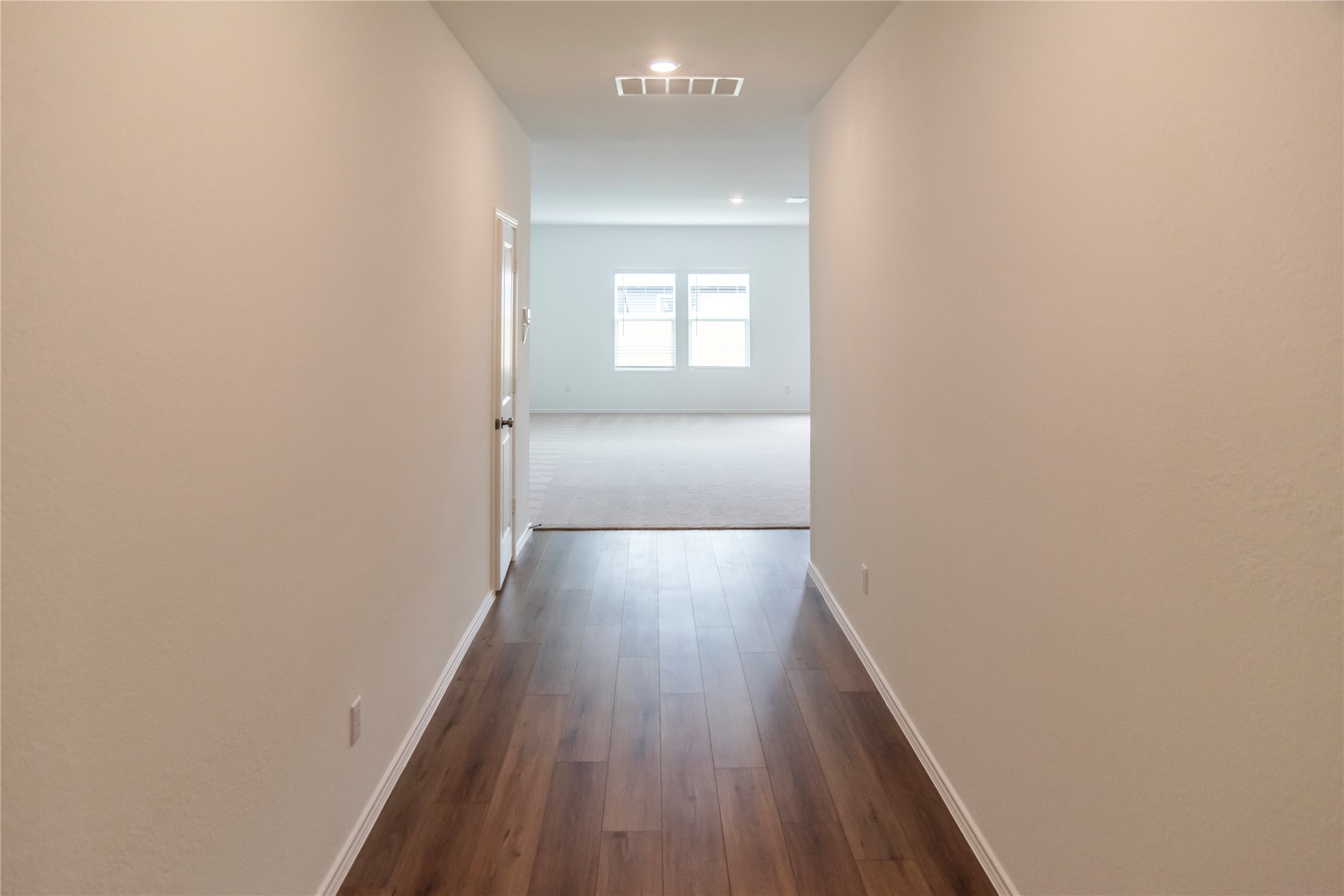 112 Dollars Drive Jarrell, TX 76537 - Photo 8 of 27 a view of wooden floor in a hallway
