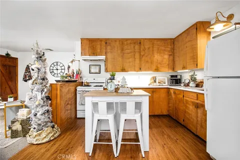 a kitchen with stainless steel appliances kitchen island granite countertop a sink and cabinets