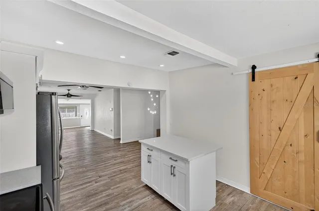 a view of an entryway with wooden floor