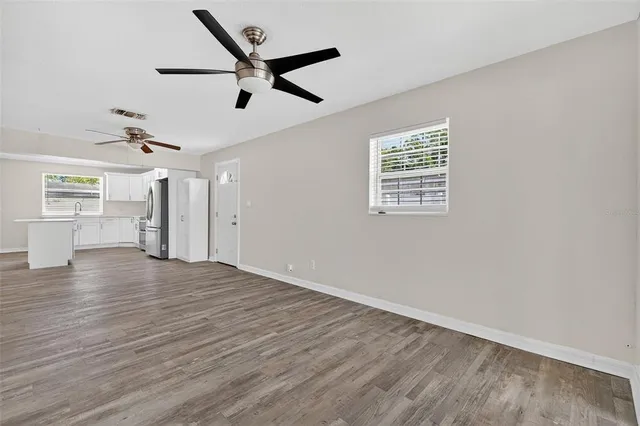 a view of an empty room with a window