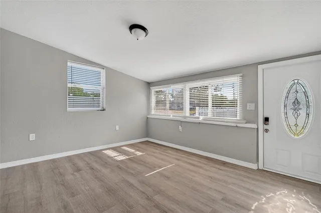 a view of an empty room with a window