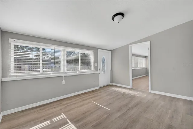 a view of an empty room with a window