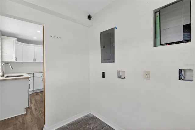 a bathroom with a granite countertop sink toilet a shower and a mirror