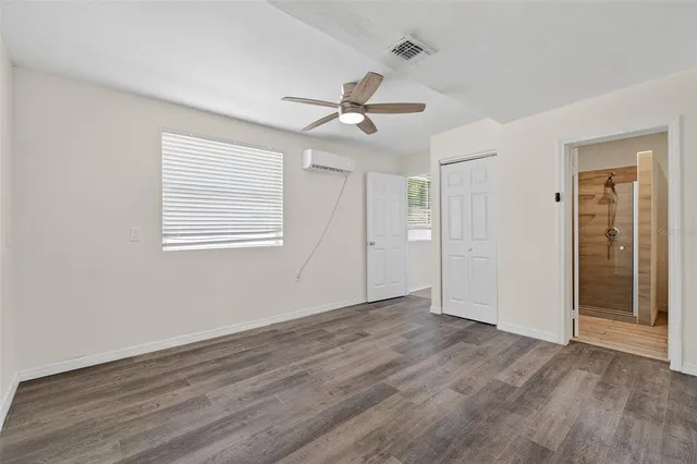 an empty room with wooden floor