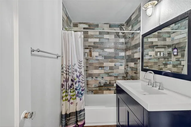 a view of a house with a backyard and a area