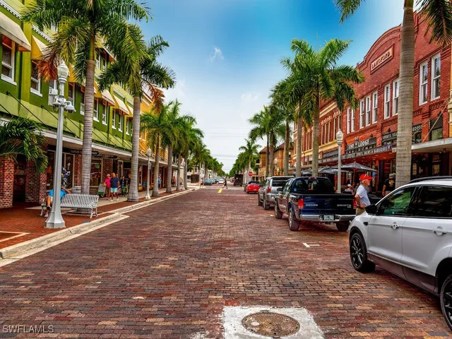 a view of street with parked cars