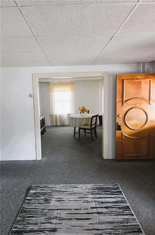a living room with furniture and a rug