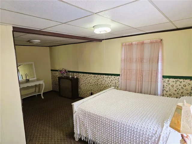 a bedroom with a bed and a table in it