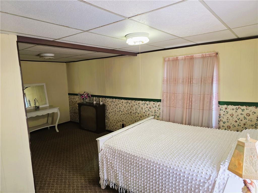 121 North Main Street Cherry Tree, PA 15724 - Photo 16 of 32 a bedroom with a bed and a table in it