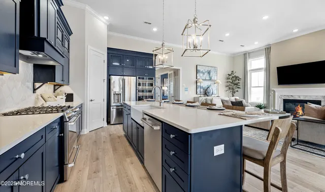 a kitchen with cabinets a sink a stove and a refrigerator