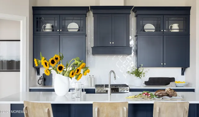 a table with a vase and flowers on it