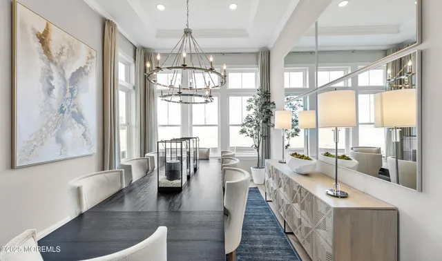 a lobby with furniture and floor to ceiling window