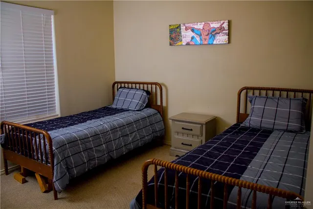 a bedroom with bed and a window